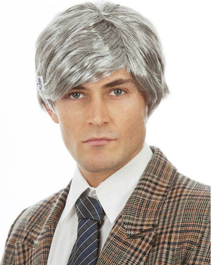 Image of man wearing checkered suit and grey Richie Benaud style wig.