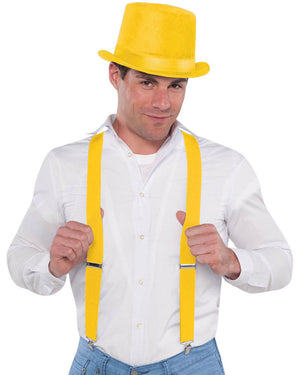Image of man wearing white shirt, yellow top hat and suspenders. 