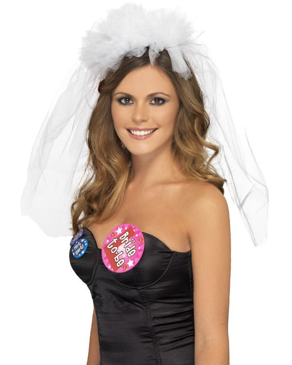Image of woman wearing white hens night tulle veil. 