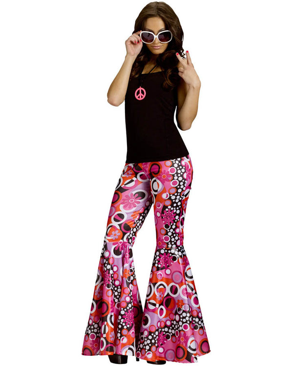 Image of woman wearing black top and 60s printed bell bottom pants. 