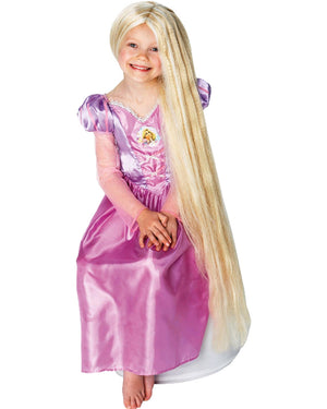 Image of girl wearing purple Rapunzel dress and long blonde glow in the dark wig.