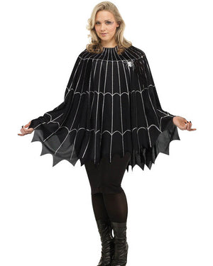 Image of woman wearing black poncho with scalloped edges and spider web print.