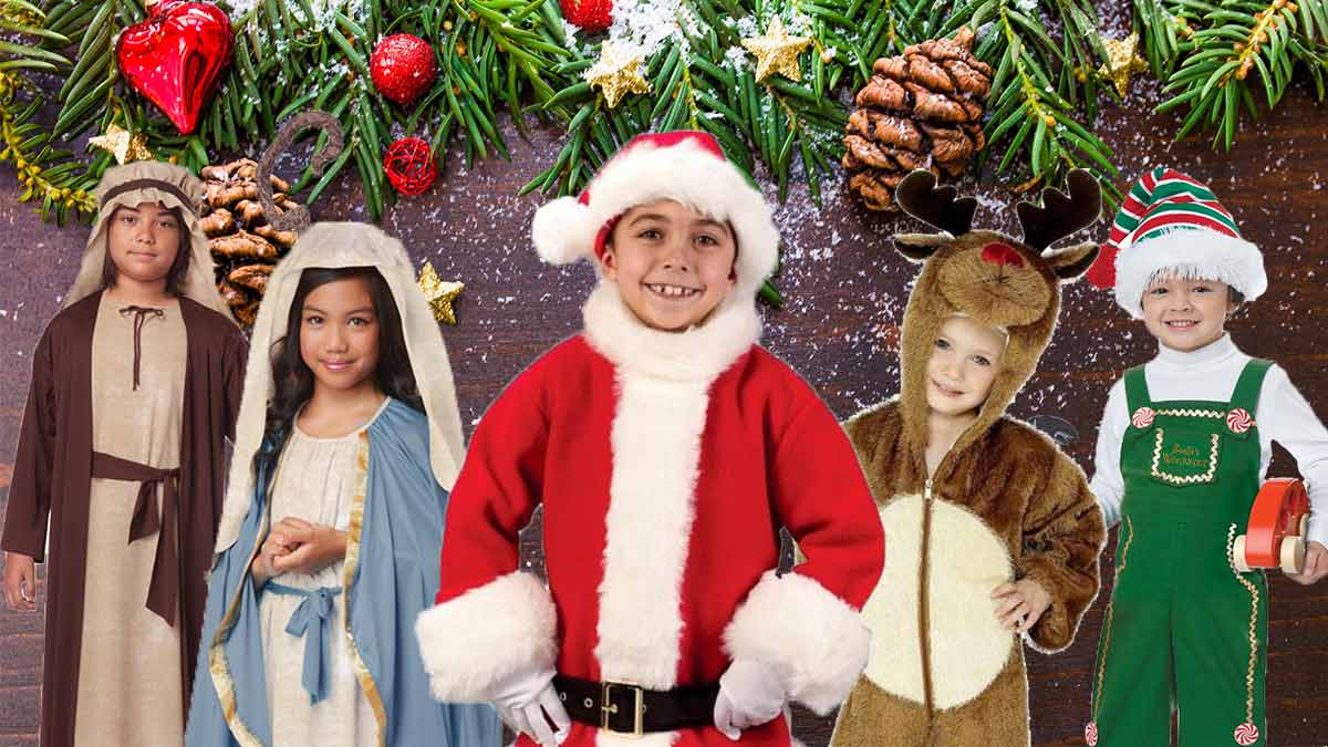 Image of five children all dressed in different Christmas costumes including a Santa Suit, Elf, Mary and more.