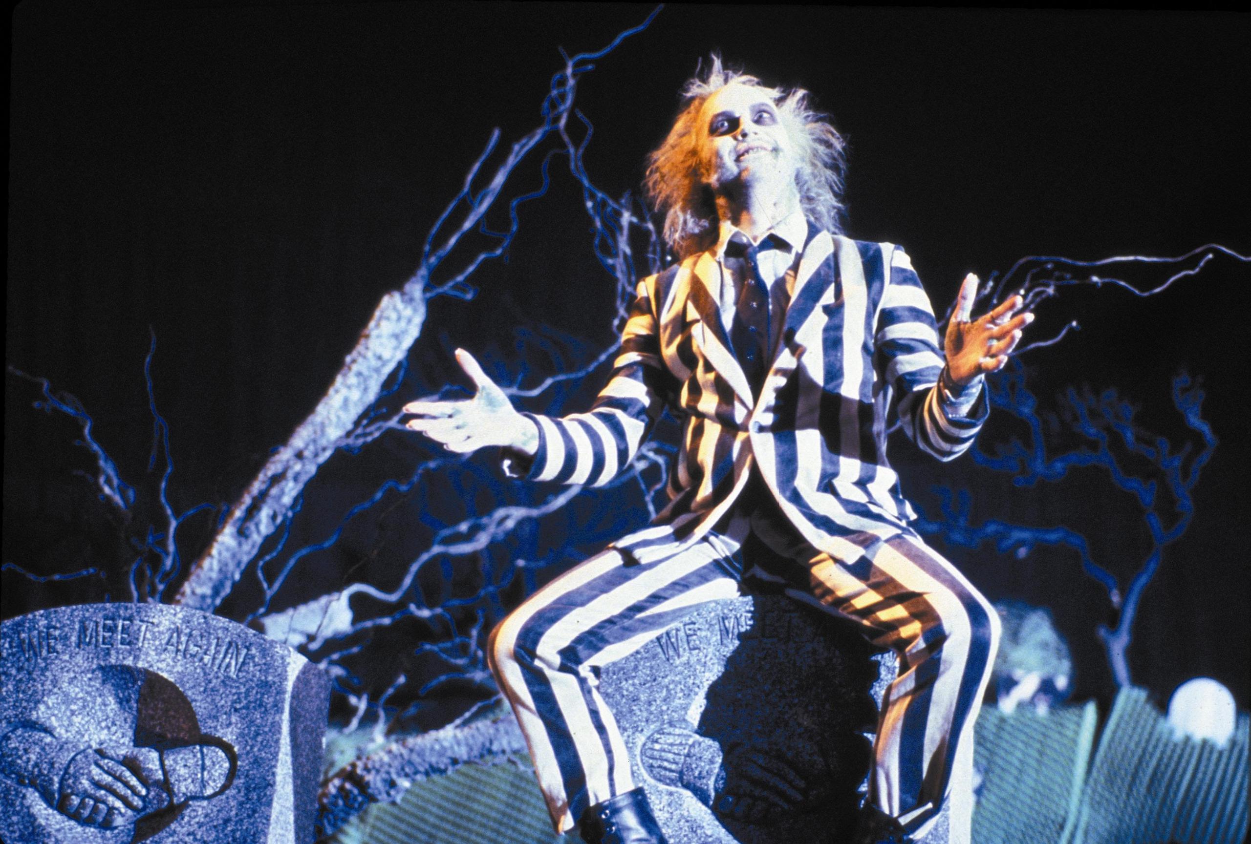 Image of Beetlejuice in black and white striped suit. 
