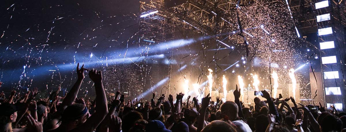 Image of crowd at festival with confetti.