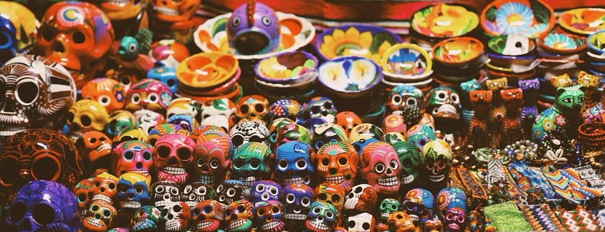 Image of lots of small colourful sugar skulls. 