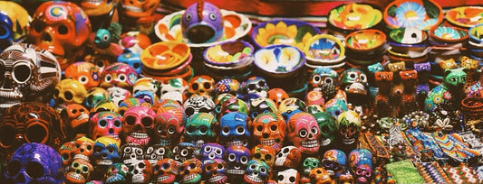 Image of lots of small colourful sugar skulls. 