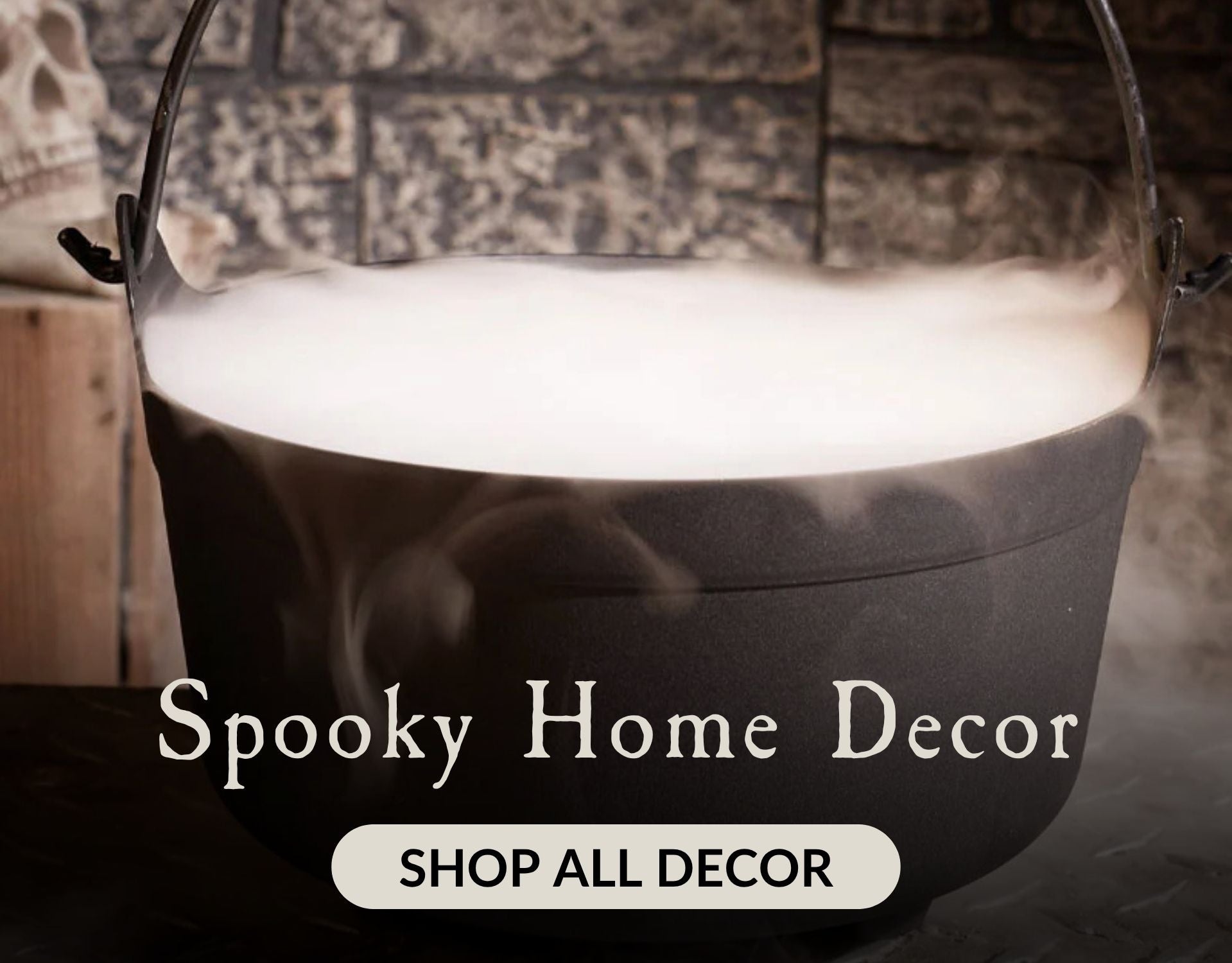 A black caldron with fog coming out and the words Spooky Home Decor. Click to shop all Halloween Decor.