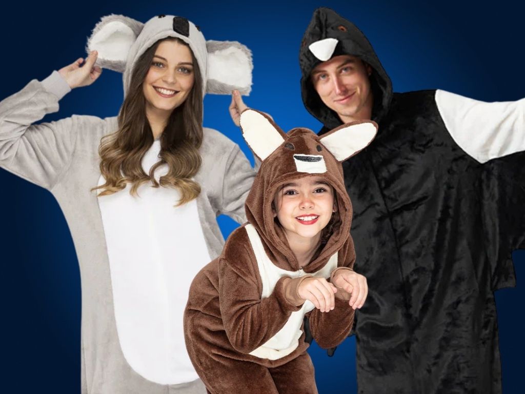 A blue background with 3 people in CostumeBox Exclusive Animal Onesies. A girl in a Kangaroo Onesie at the front, at the back a man in a magpie onesie and a woman in a koala onesie. Shop all onesies today.