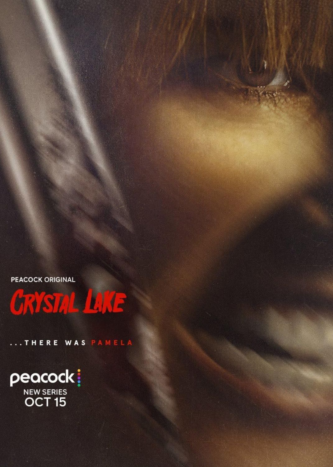 Promotional poster for the Peacock Original series "Crystal Lake." The background features a dramatic, motion-blurred close-up of a person's face framed by brown hair, with a bright eye looking upward. In the lower-left corner, the title "Crystal Lake" is written in dripping red font, followed by the tagline "...there was Pamela" in white and red text. Below is the Peacock logo with the text "New Series OCT 15."