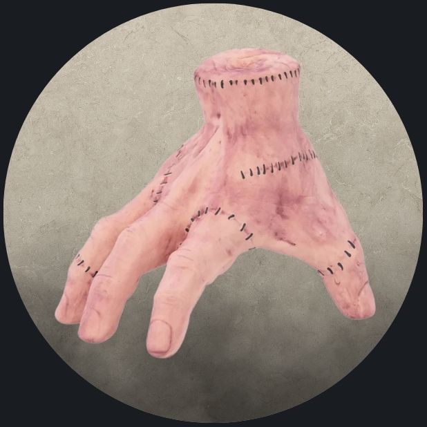 A beige circle with the Addams Family Thing Hand. Click to shop all Halloween Accessories. 