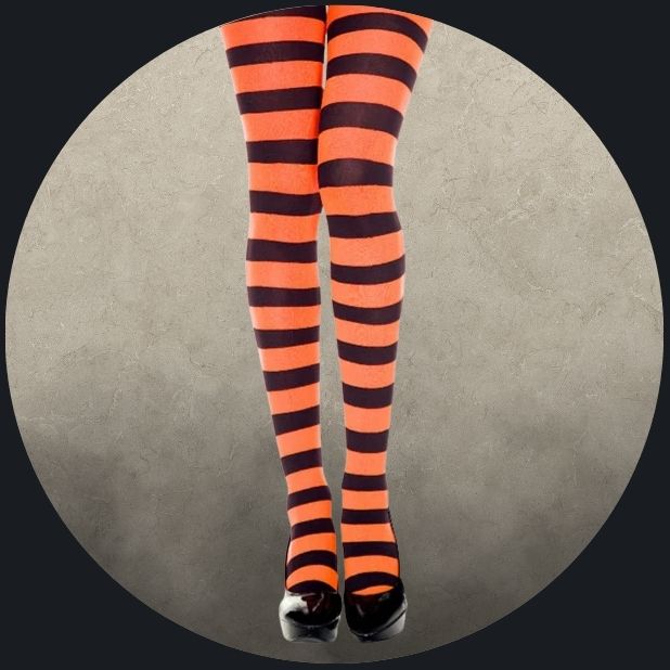 A beige circle with womens legs wearing a black and orange striped stocking. Click to shop all Halloween Hosiery. 