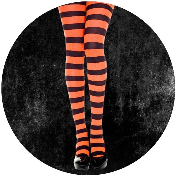 A black circle with womens legs wearing a black and orange striped stocking. Click to shop all Halloween Hosiery. 