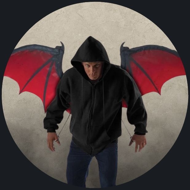 A beige circle with a man wearing black and red bat wings. Click to shop all Halloween Wings and wands.
