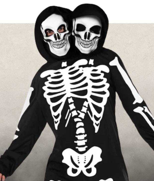 A man wearing a two headed skeleton costume on a beige background. Click to shop all Skeleton Halloween Costumes. 