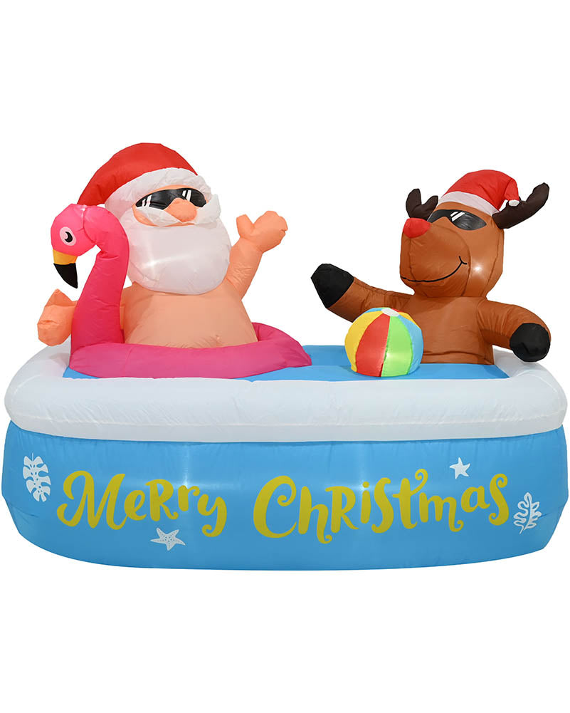 Inflatable Christmas pool party scene with a Santa Claus figure sitting in a pink flamingo float, a brown reindeer figure wearing a Santa hat, and a small multicolor beach ball on a blue inflatable pool with yellow 'Merry Christmas' lettering.