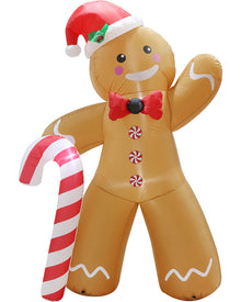 Inflatable gingerbread man Christmas decoration with a red Santa hat, red bow tie, candy accents, and a large red-and-white striped candy cane, shown on a plain white background.