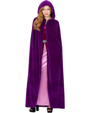 Person wearing a purple hooded cloak over a pink dress on a white background