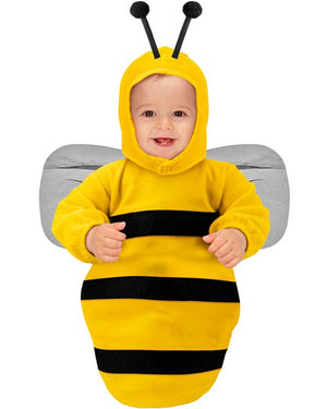 Baby in a bee costume with yellow and black stripes on a white background