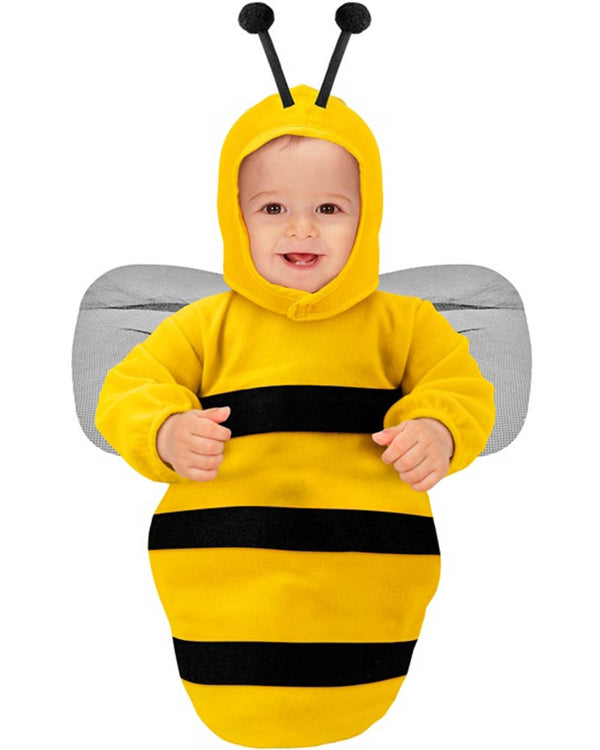 Baby in a bee costume with yellow and black stripes on a white background