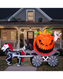 Halloween inflatable with a pumpkin and skeleton horse and carriage in front of a house.