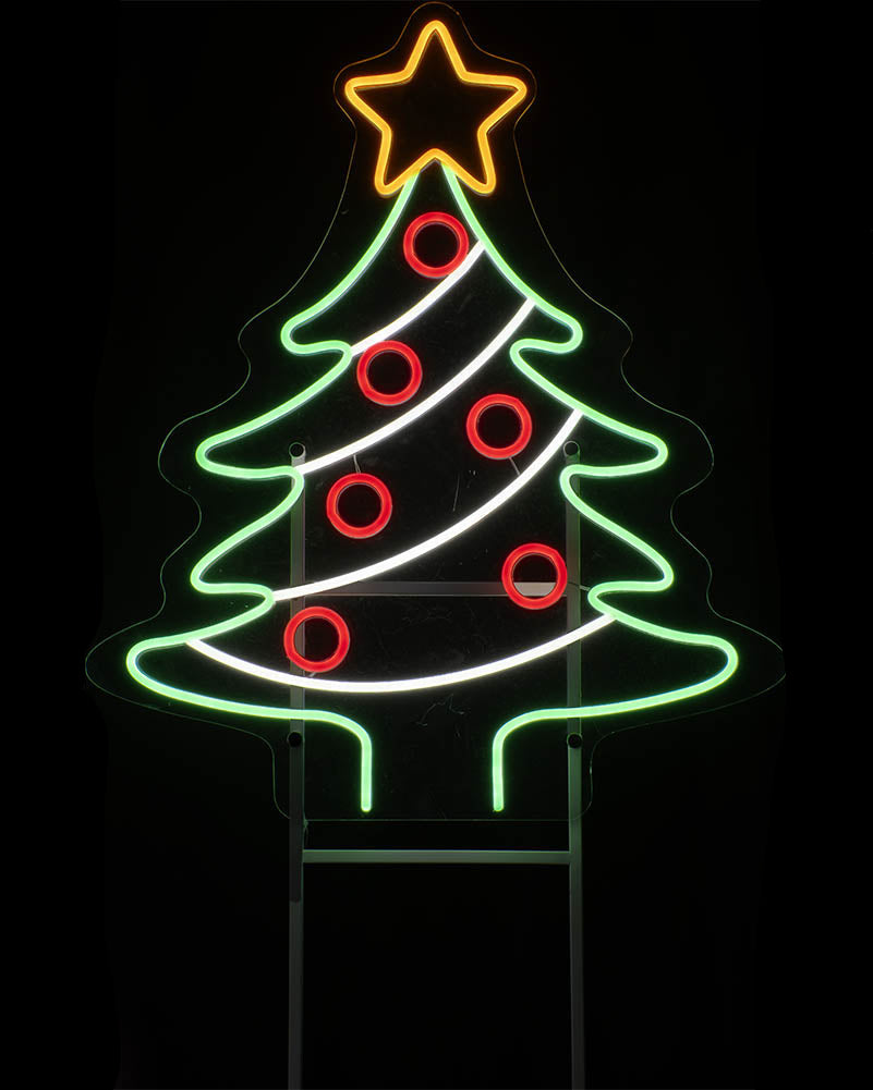 A neon Christmas tree sign with a glowing green tree outline, red circular ornaments, a yellow star topper, and white diagonal stripes, shown against a black background.