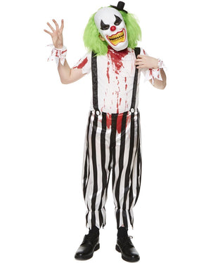 Person wearing a scary clown costume with green hair, white face, black suspenders, and striped pants on a white background.