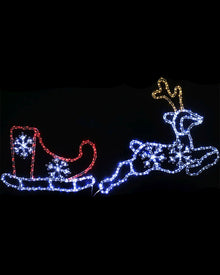 LED holiday light decoration shaped like Santa's sleigh and a reindeer, shown illuminated against a black background. The sleigh is outlined in red with blue snowflake details, and the reindeer is outlined in blue with gold antlers.