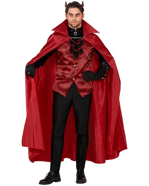 Man wearing a red and black costume with a long red cape on a white background
