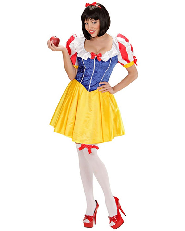 Person wearing a Snow White costume holding an apple on a white background