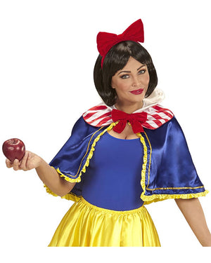 Person in Snow White costume holding an apple on a white background