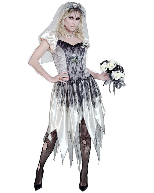 Person wearing a gothic wedding dress with a veil and holding flowers on a white background
