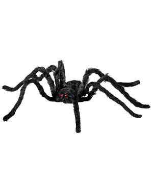 Black spider toy with red eyes on a white background
