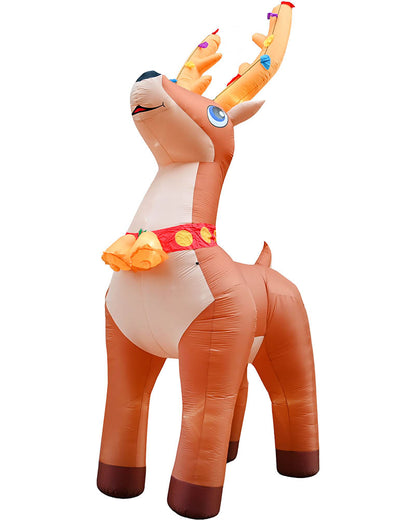 An inflatable Christmas reindeer decoration standing on a plain white background. The reindeer is primarily orange-brown with a cream belly and face, decorated with a red patterned collar and small colorful ornaments on its antlers.