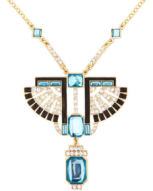 Elegant necklace with blue gemstones and gold accents on a white background