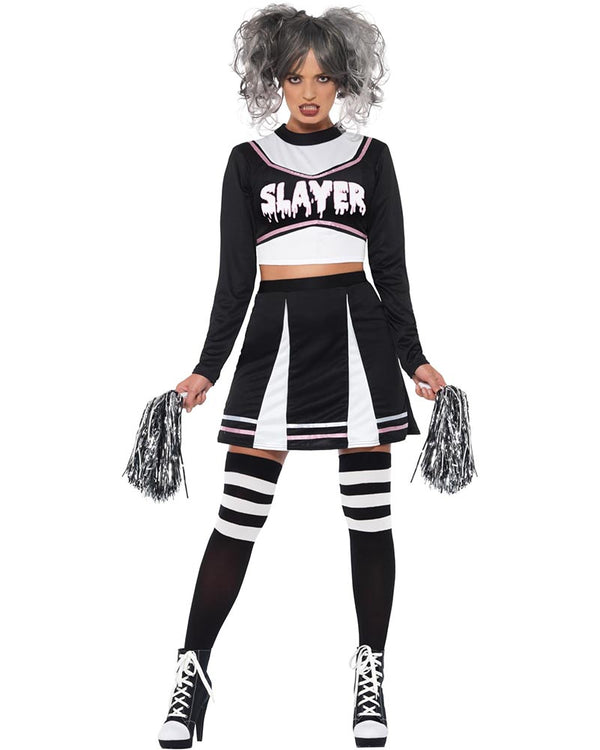 Person wearing a black and white costume with 'SLAYER' text, holding pom-poms on a white background