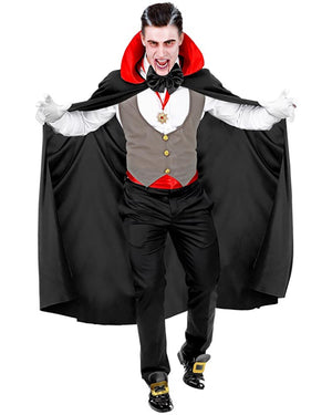 Person in a vampire costume with a black cape, red shirt, and gray vest on a white background