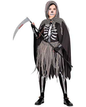 Person wearing a Halloween costume with a skeleton design and holding a scythe on a white background