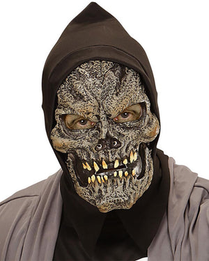 Person wearing a dark hooded outfit with a detailed skull mask on a white background
