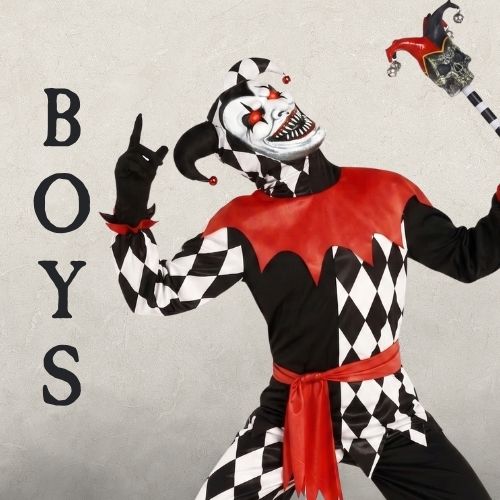 A Boy wearing a black, white and red clown costume on a beige background with the heading BOYS. Click to shop all boys Halloween Costumes. 