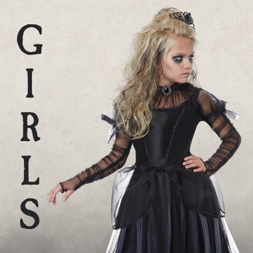 A Girl wearing a black witch halloween costume on a black background with the text GIRLS. Click to shop all girls halloween costumes.