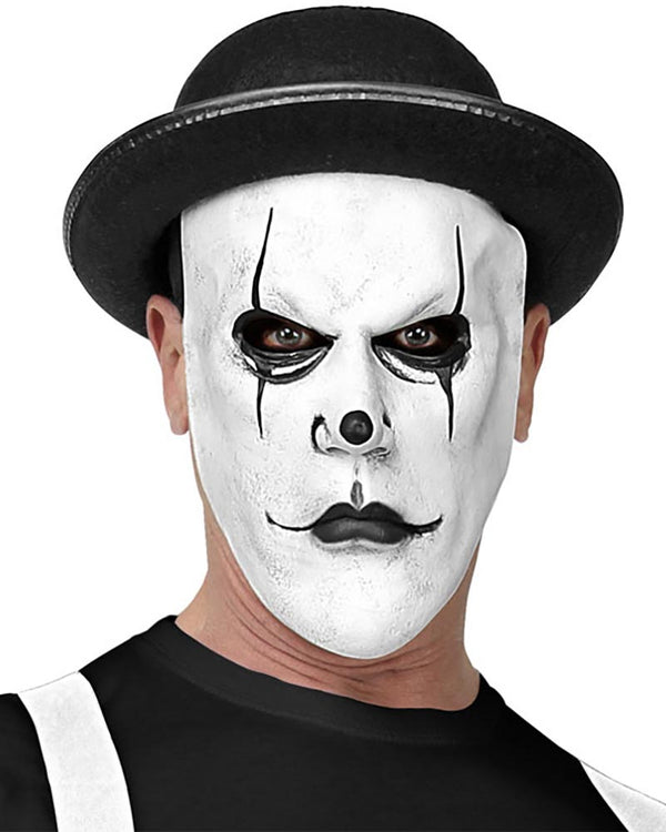 Person wearing a white mask with black accents and a black hat on a white background