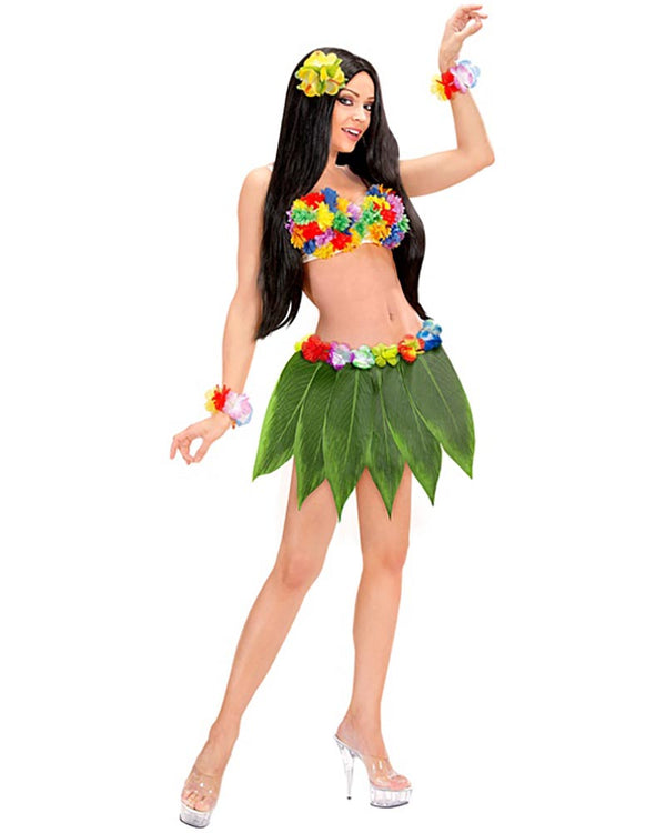 Woman in a hula costume with a green leaf skirt and colourful accessories on a white background