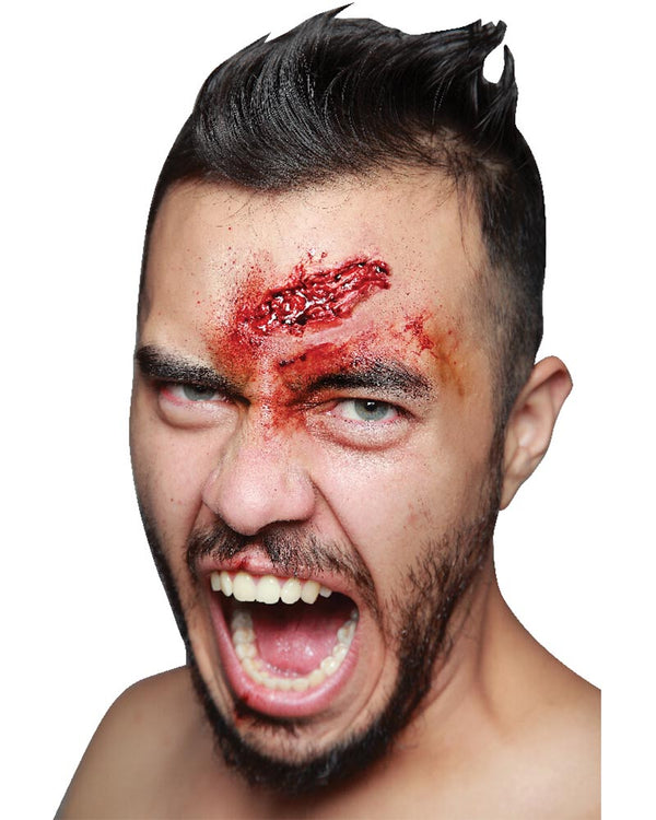 Man with a fierce expression and red mark on his forehead against a white background
