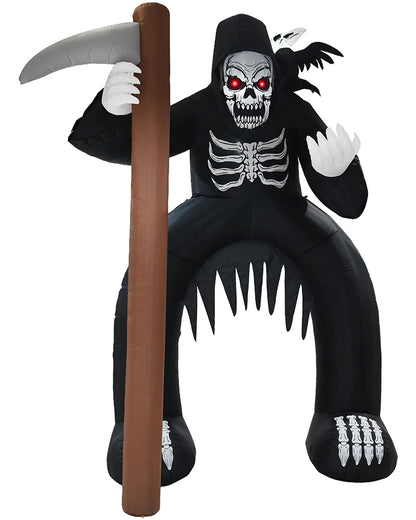 An inflatable Grim Reaper Halloween decoration in black, featuring a skull face with glowing red eyes, white skeletal details, bat wings, a large scythe with a brown handle, and sharp teeth along the bottom, isolated on a white background.