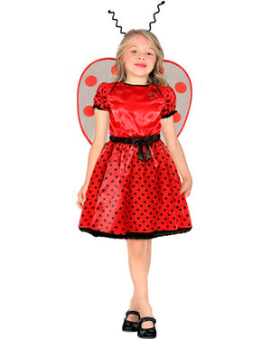 Child wearing a red ladybug costume with black polka dots on a white background
