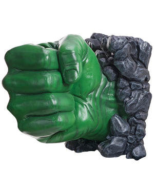 Green superhero fist crushing a stack of gray rocks on a white background