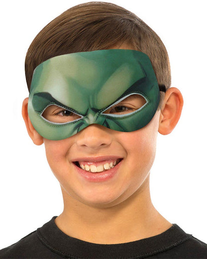 Child wearing a green superhero mask on a white background