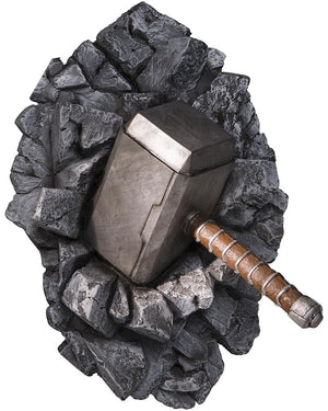  3D wall art of Thor's hammer surrounded by rocks 