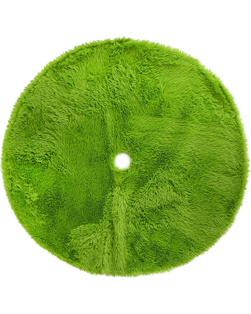 A round, lime green shaggy faux fur rug with a central hole for hanging, shown against a plain white background.